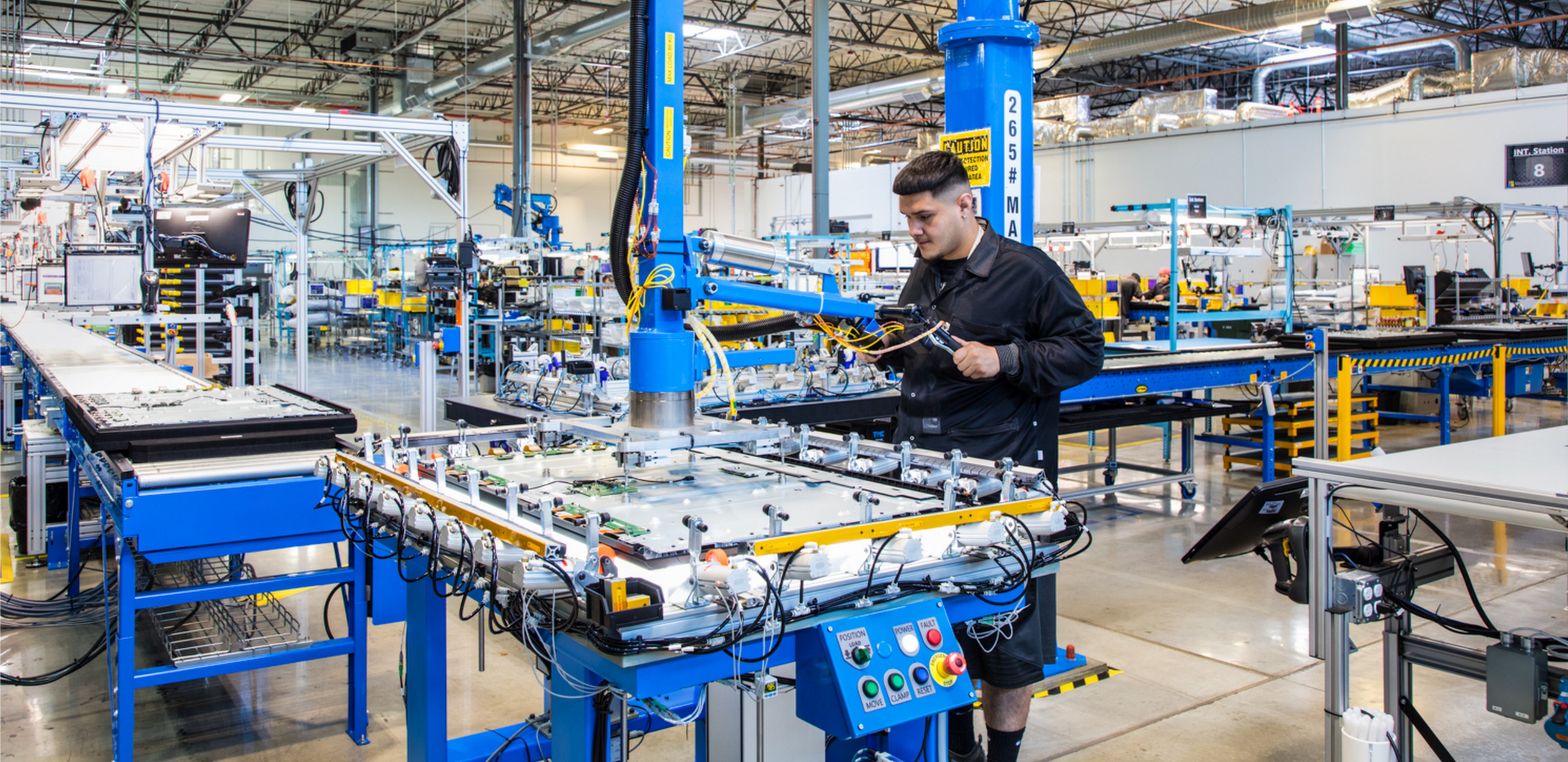 Man standing working in a factory.