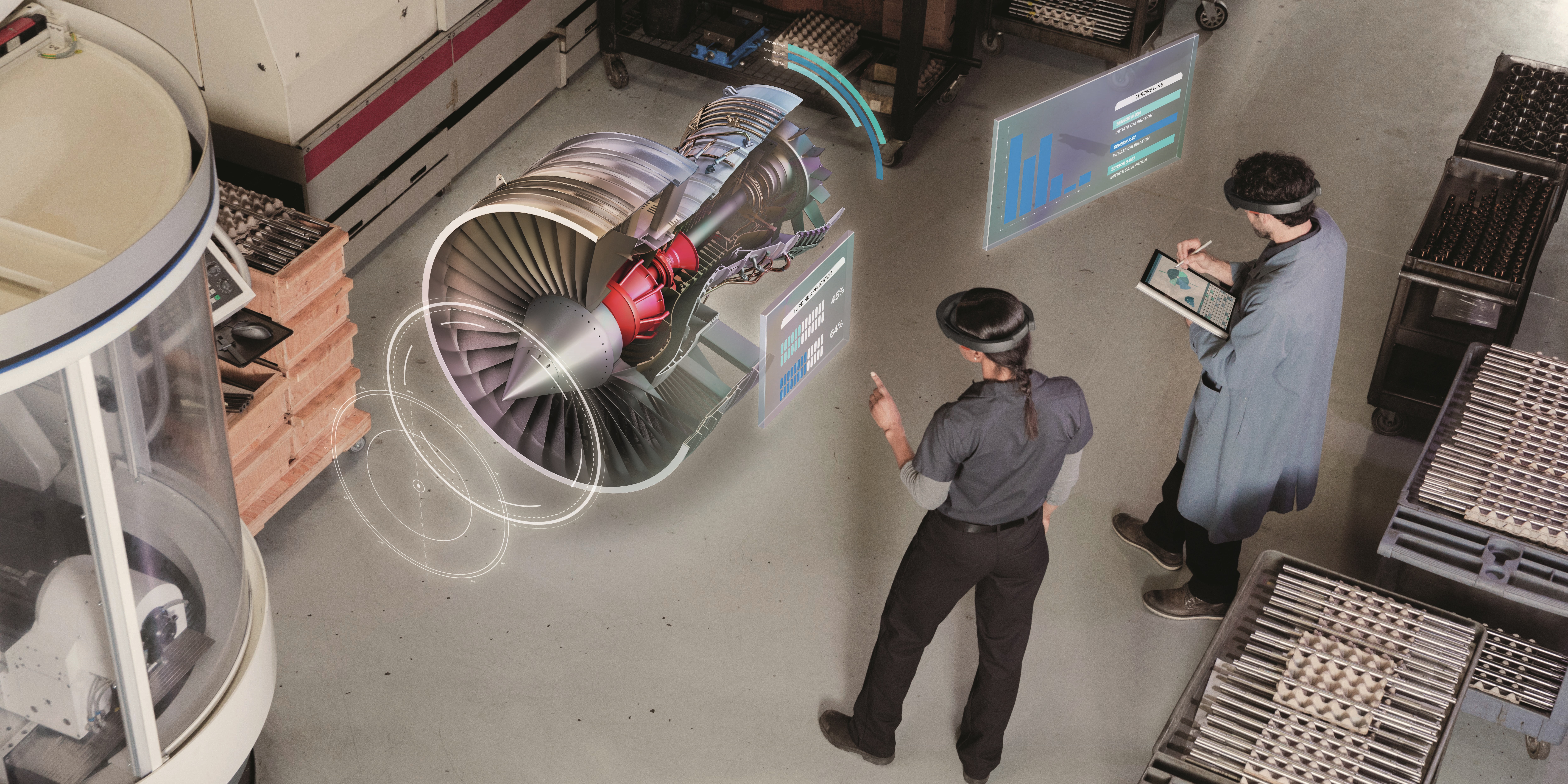 Two people wearing mixed reality headsets working in a factory
