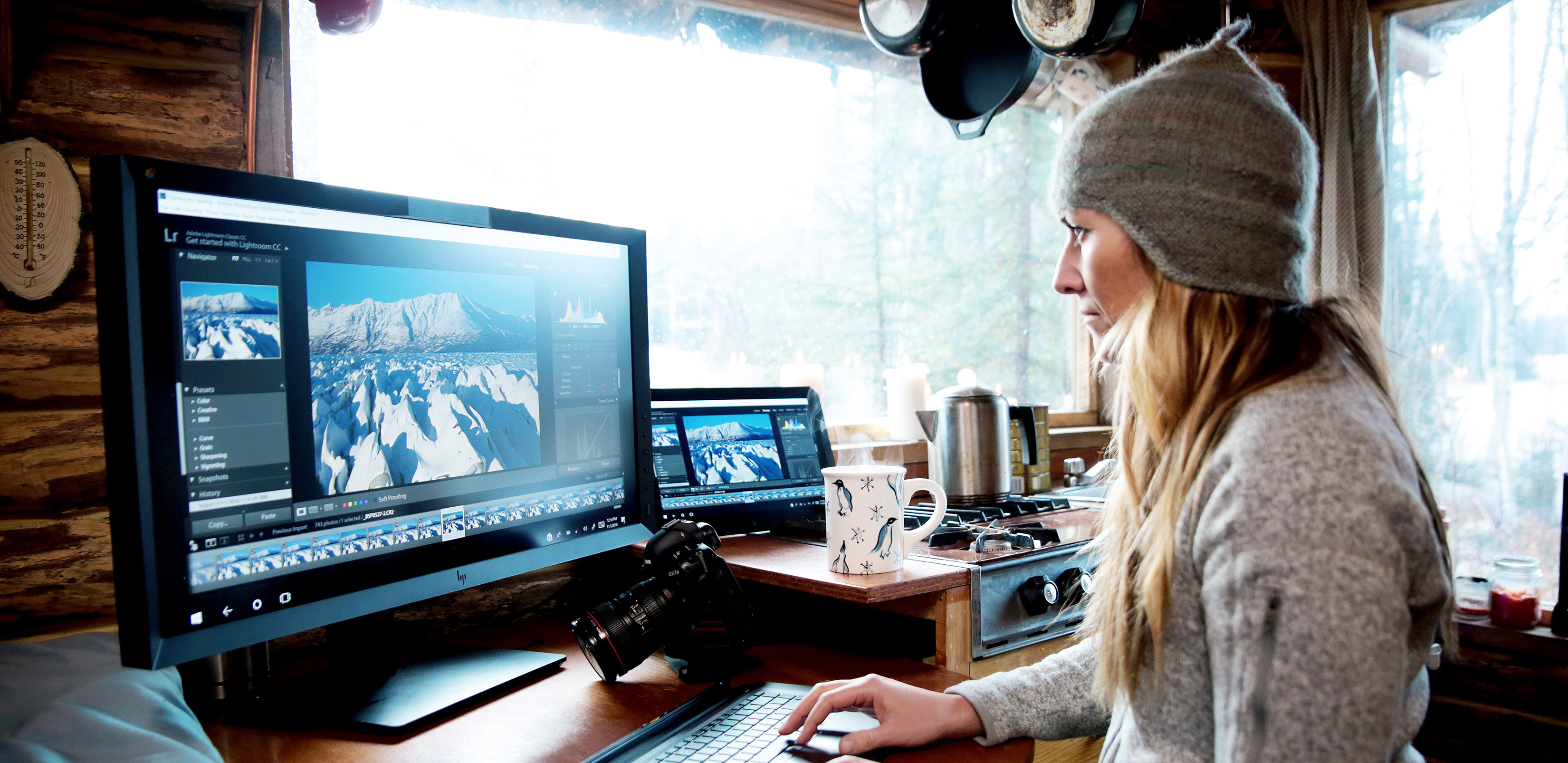 a woman works on a computer in a cabin