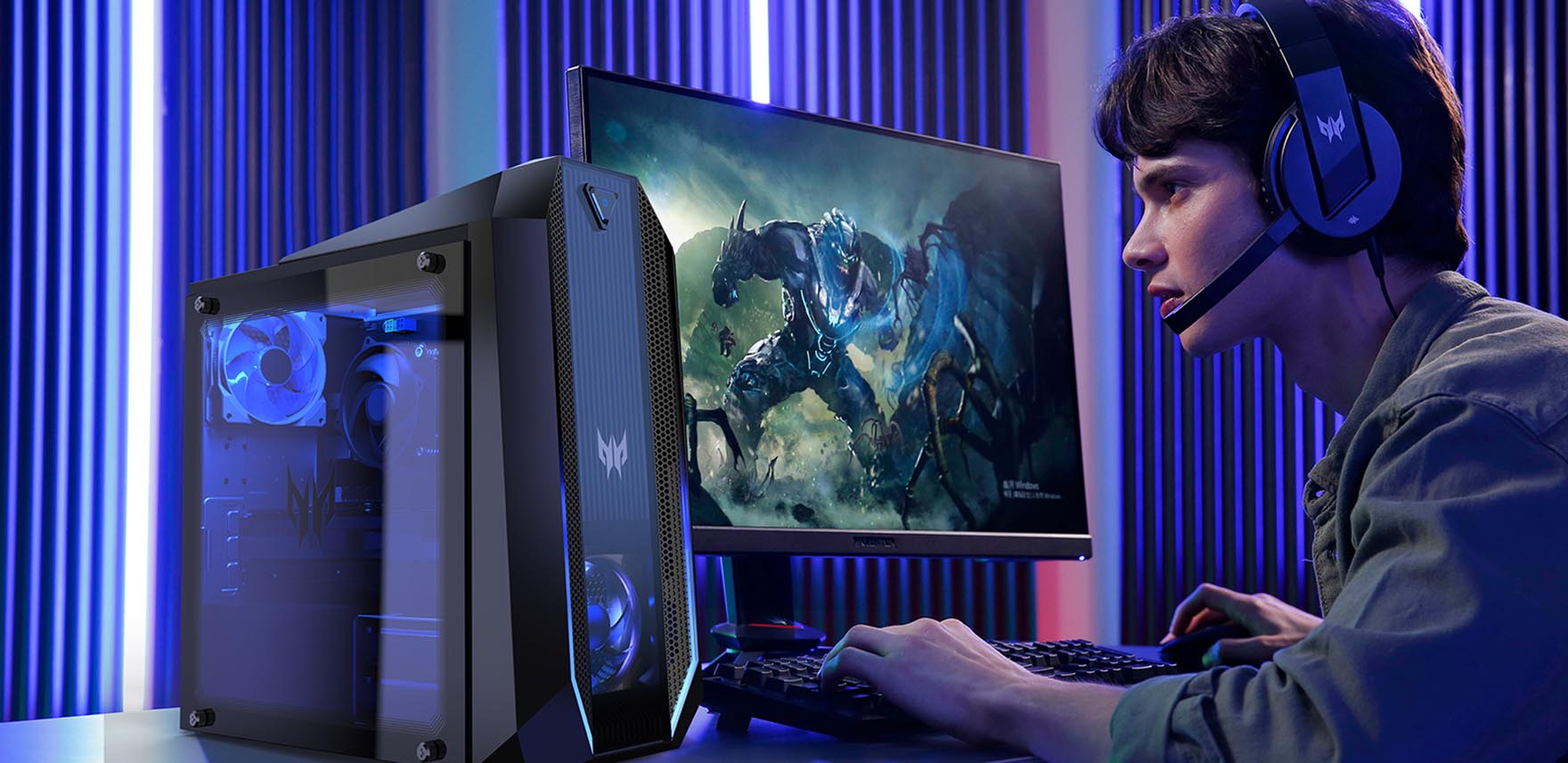 Young man playing a game on Predator Orion 3000, wearing headphones