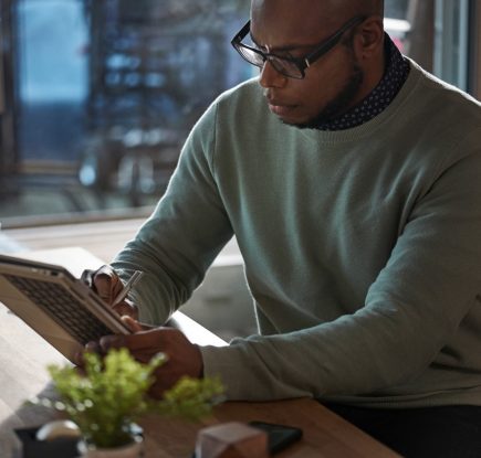 man looking at a tablet