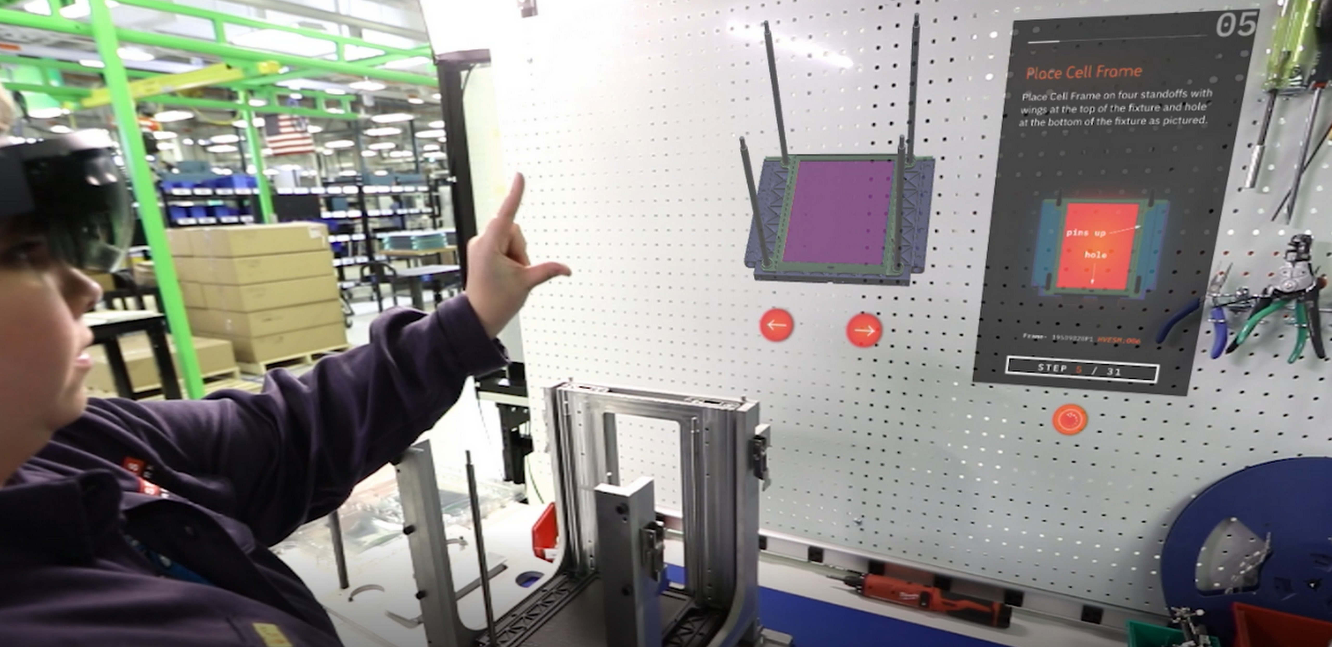 Person wearing Microsoft HoloLens and looking at a hologram