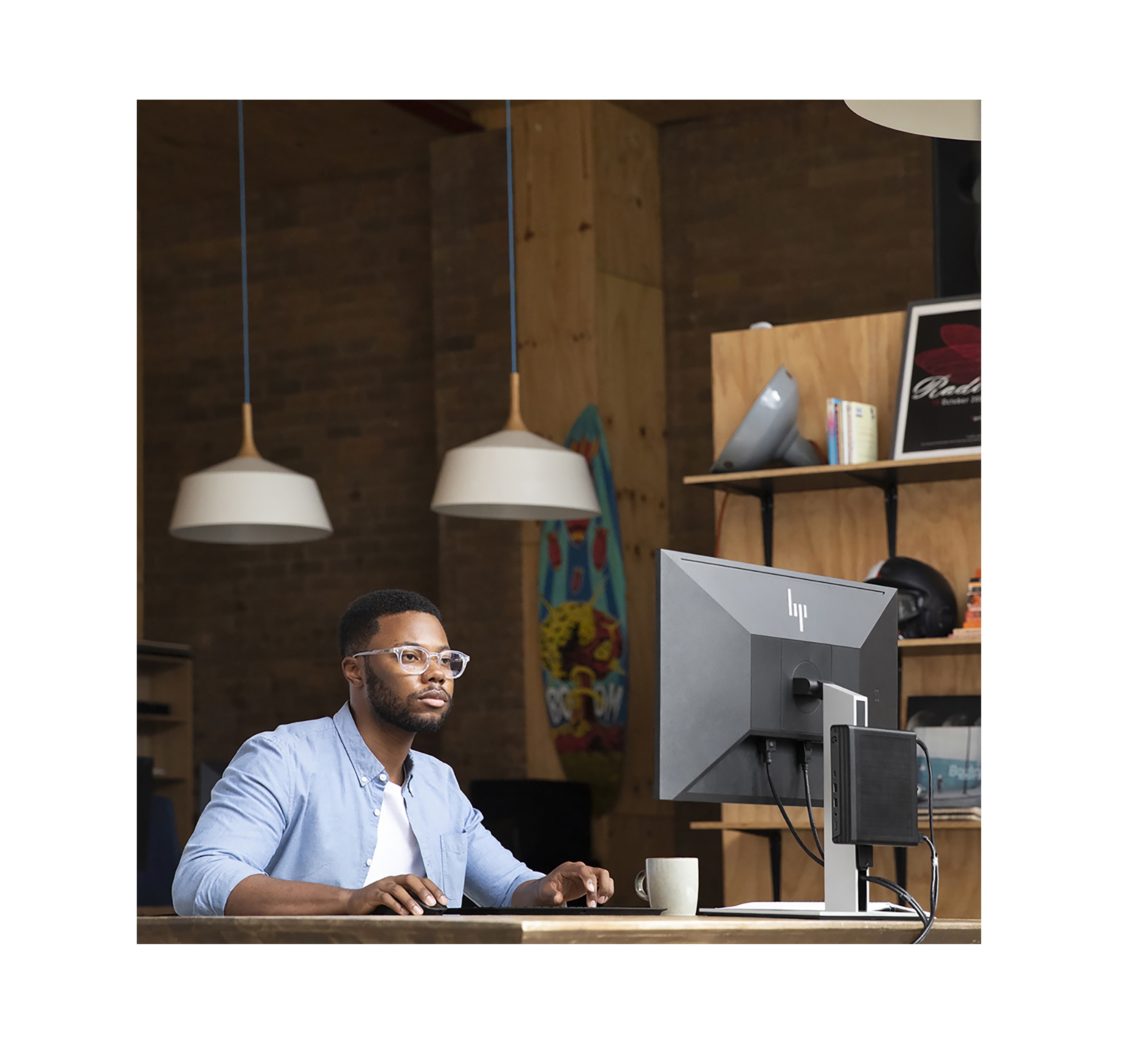 Man working in front of HP desktop
