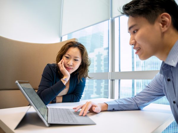 Woman and man looking at a tablet computer