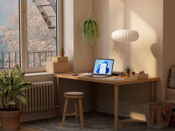 Laptop running Windows 11 on a table in a home
