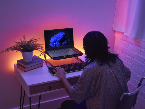 Woman working on a laptop computer running Windows 11