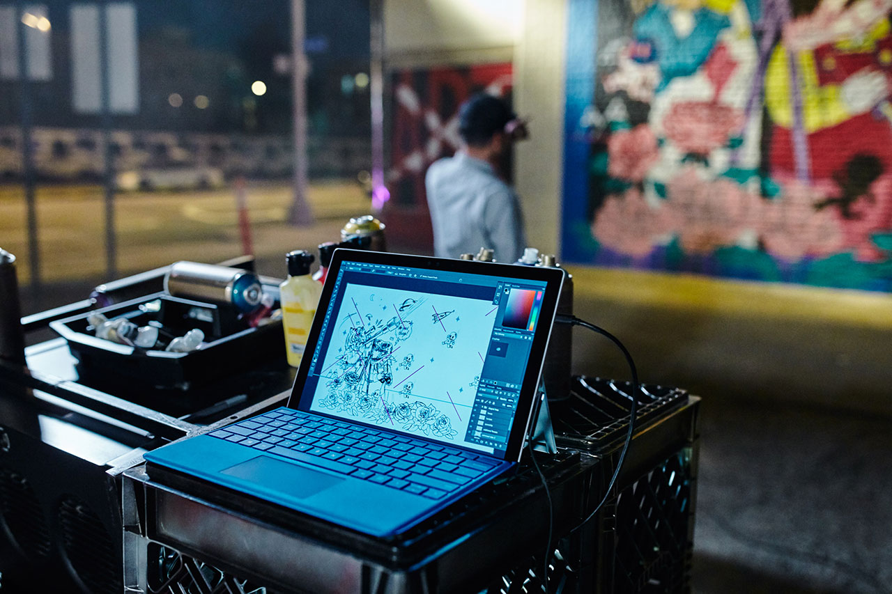 Sketching mural art with the help of Surface Pro 4.