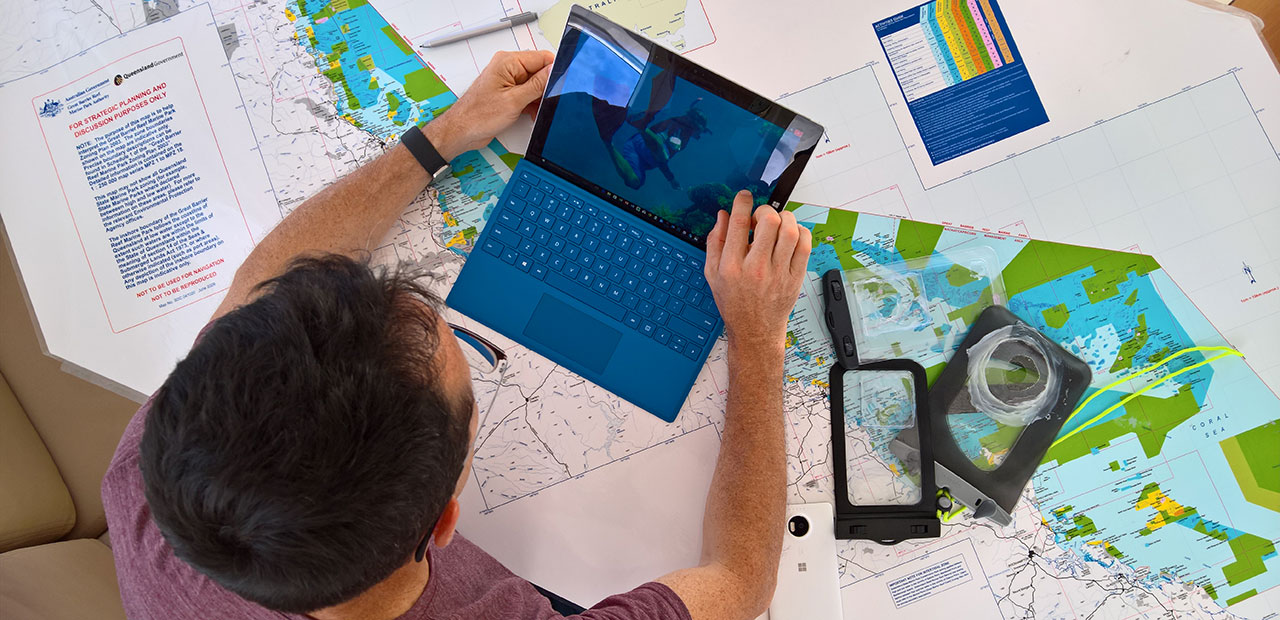 National Geographic photographer Stephen Alvarez editing photos on Surface.