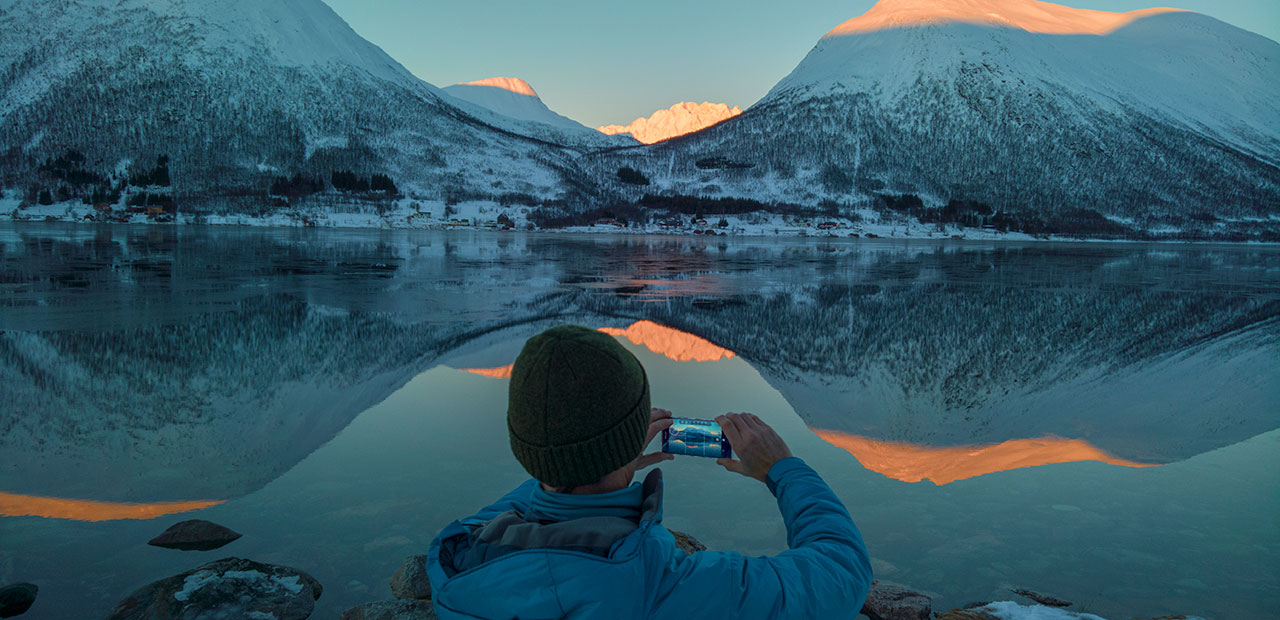 Stephen Alvarez capturing the shadow, light, and water that create dramatic reflections and silhouettes along the Synnov Nordvegen Road near Tromso, Norway.